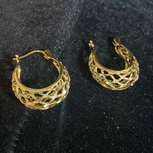 Women’s beautiful hooped earrings.